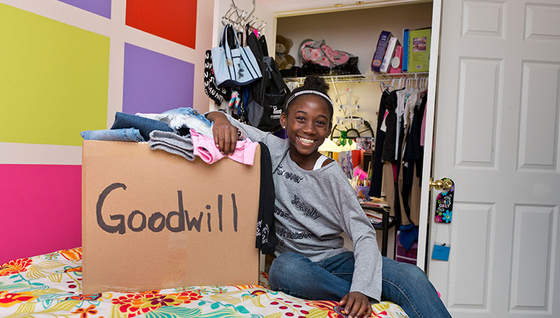 Material Donations - Girl Donating