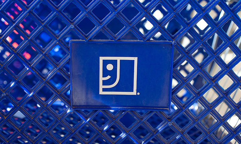 Goodwill logo on a blue shopping cart