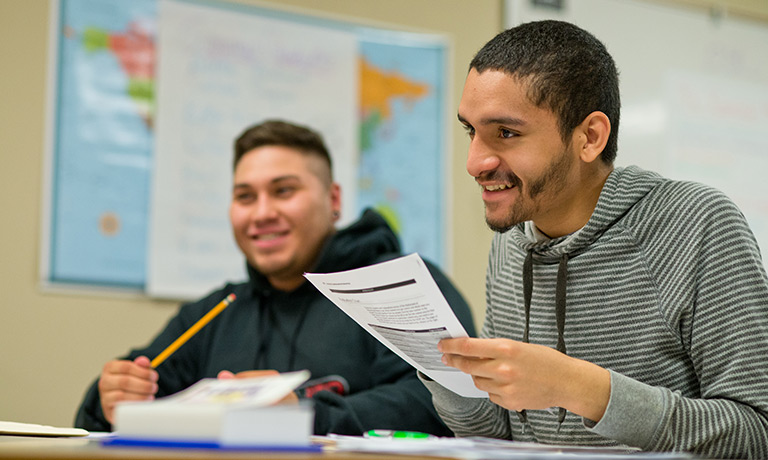 two young man participate in the classroom